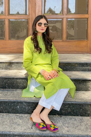 Manto Community wearing Khayaal Lime Green Kurta with Urdu Calligraphy