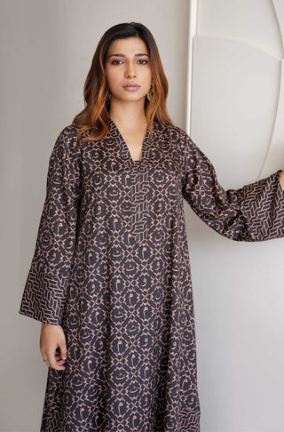 Manto Two Piece Soft Crepe Ayra Coord Set in Black & Gold, with Long Shirt and Straight Trouser Pants. Featuring Random Urdu Letters Throughout the Shirt.