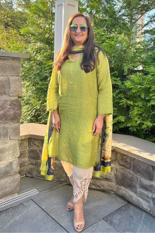 Manto Community wearing Khayaal Lime Green Kurta with Urdu Calligraphy