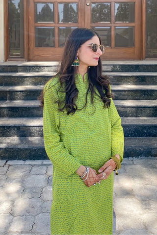 Manto Community wearing Khayaal Lime Green Kurta with Urdu Calligraphy
