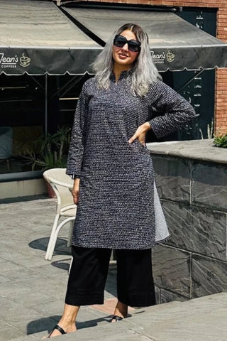 Manto Community wearing Khayaal Black Kurta with Urdu Calligraphy