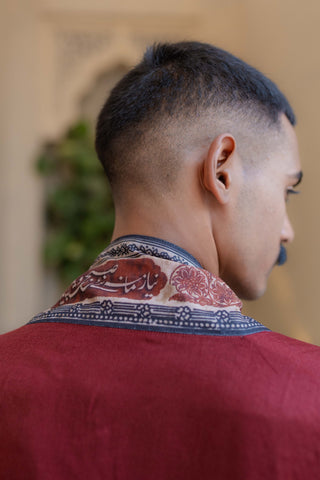 Shopmanto, wear manto, manto clothing brand, unisex cape shawl, cape shawl, men cape shawl, women cape shawl, capes, shawl, winter wear, eastern, western, urdu calligraphy on the cape shawl, cape in maroon, men outerwear, women outerwear, ishq cape maroon and beige, manto capes, manto shawl