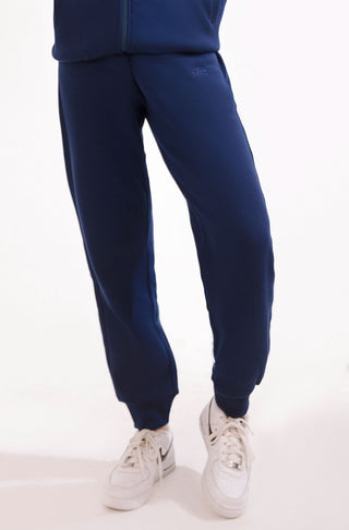 Shopmanto, wear manto, pakistan, women, men, ladies, clothing, urdu, calligraphy, jogger pants, winter wear, karachi, western clothing, manto store, urdu calligraphy clothing, unisex jogger pants, unisex winter wear, hoodies in pakistan, jogger pants for men, jogger pants for women, track pants, track suits, comfort, soft, midnight blue Jogger pants, manto logo embroidery on jogger pants, comfort revolution