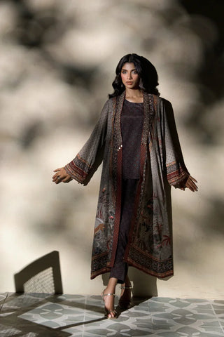 Woman wearing Manto's long, patterned coat in an indoor setting, featuring Urdu calligraph & Illustration