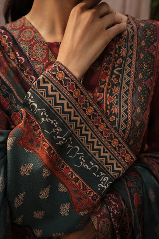 Close-up of a person wearing a patterned garment with intricate designs.